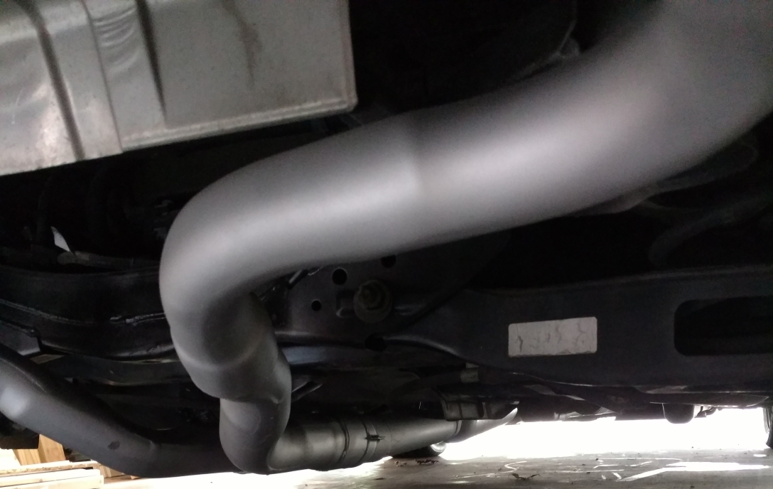 exhaust system image with long sloping bends welded and painted silver